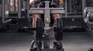 Person using a seated calf raise machine