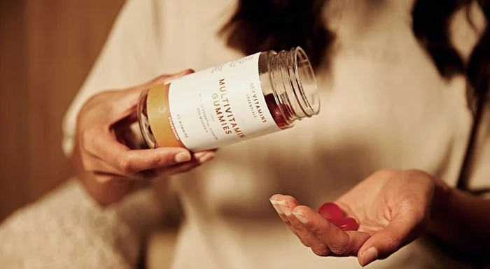 Person tipping Myvitamins Multivitamin Gummies into their hand