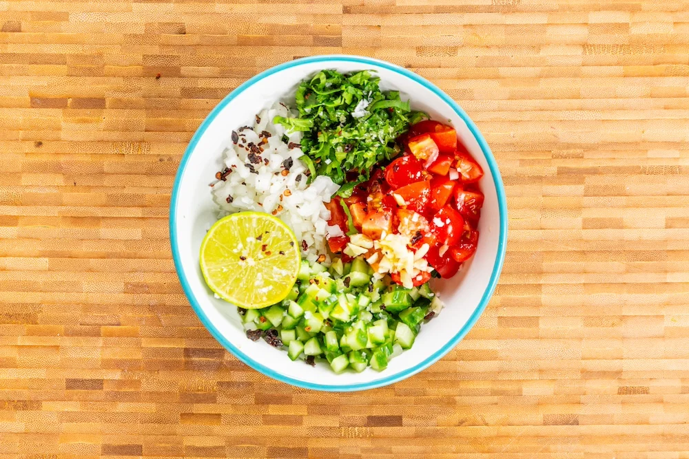 Chopped ingredients for Prawn Tacos in the bowl.