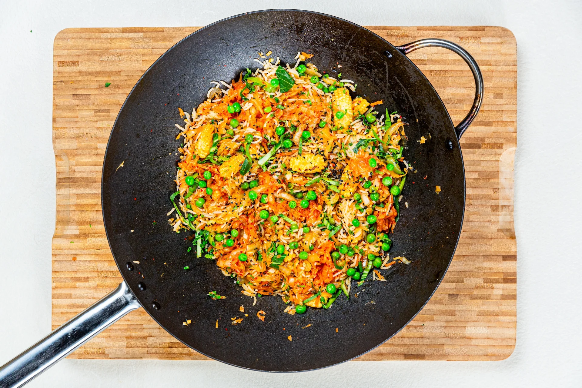 Kimchi fried rice chopped ingredients cooked in a pan
