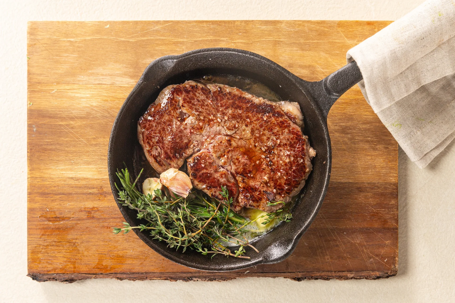 Cooked beef steak in a pan.
