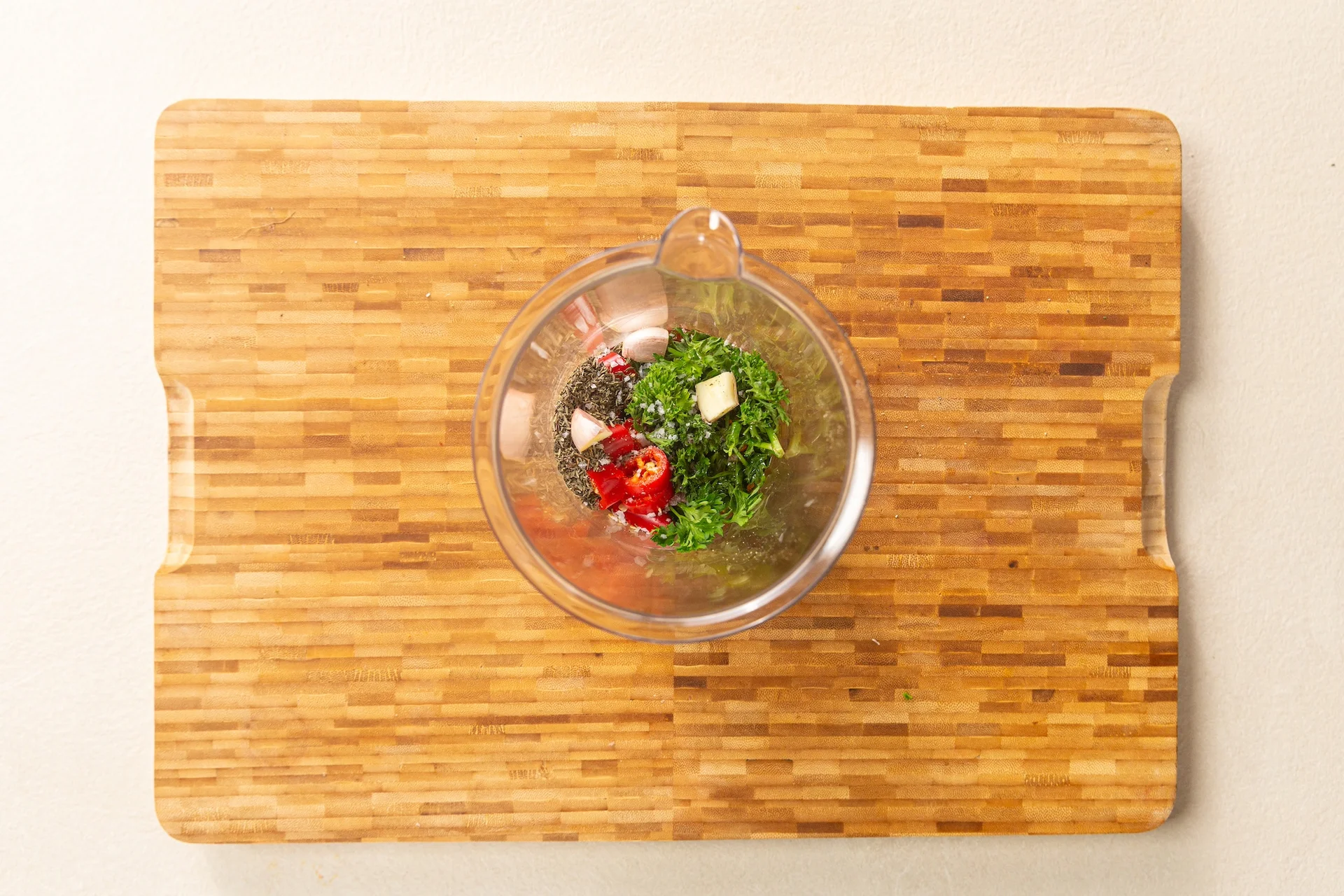 Chopped ingredients in a blender.