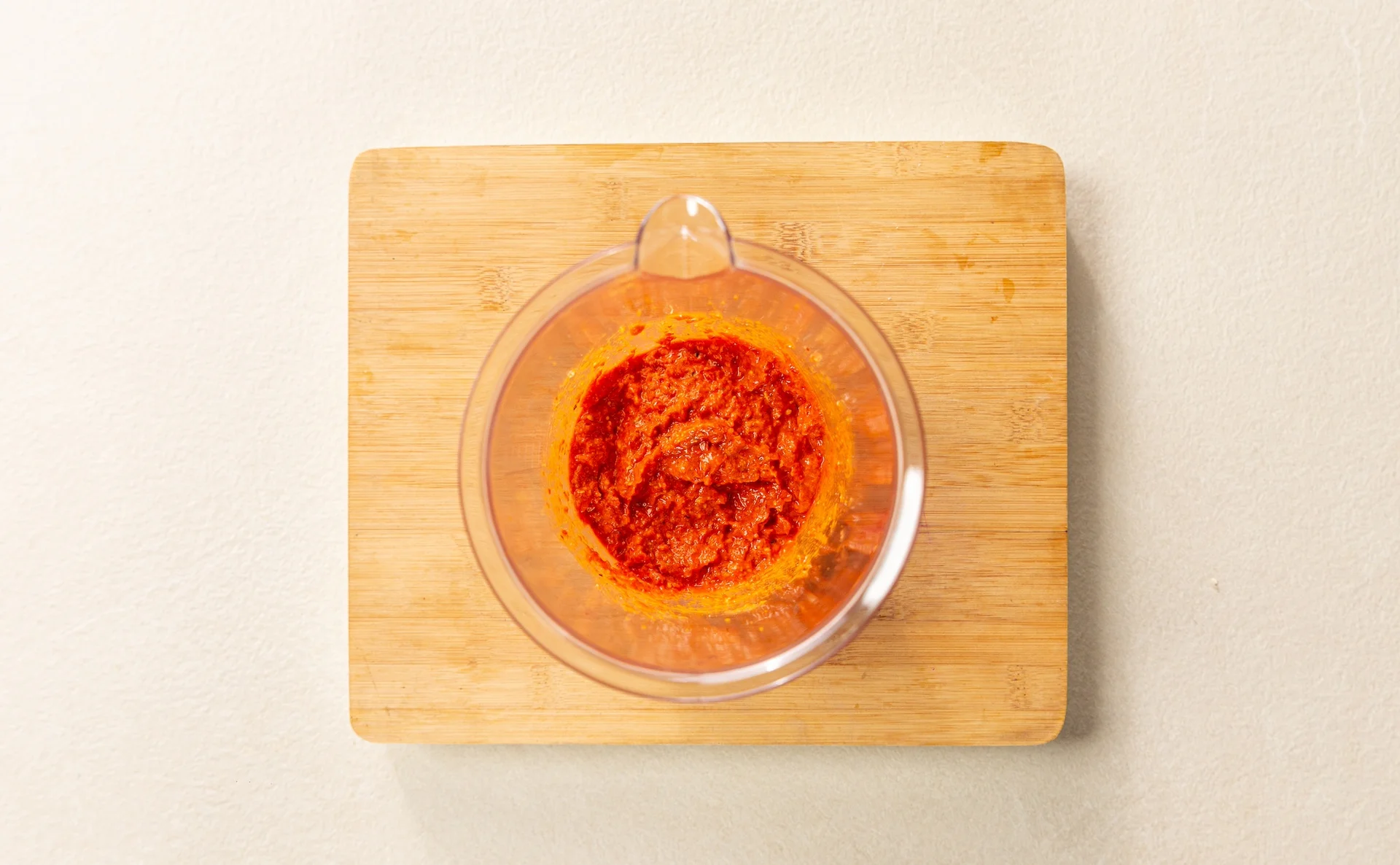 Blended tomatoes, garlic, and peppers to make a red pesto.