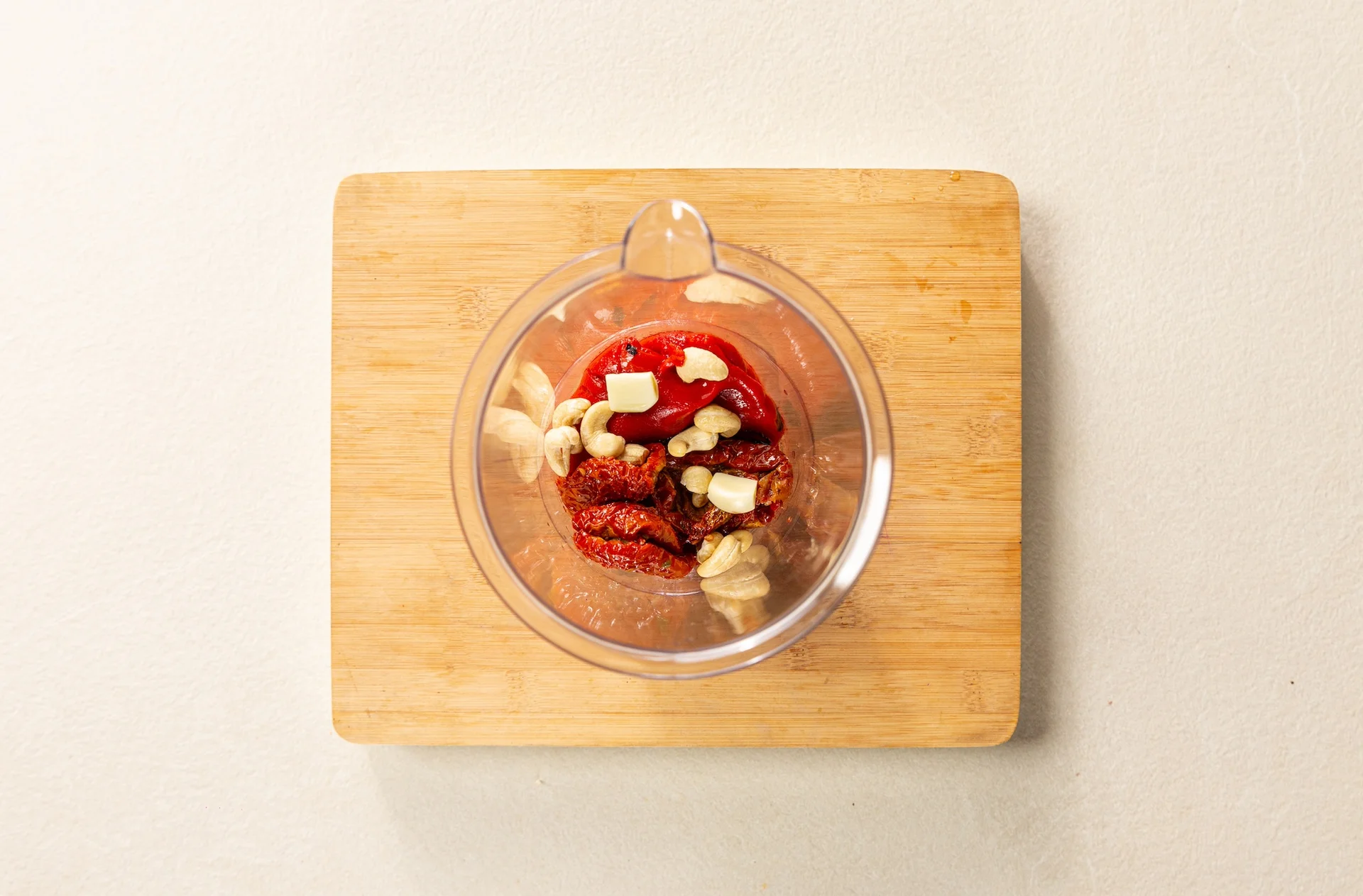 Tomatoes, garlic, and peppers in a blender.